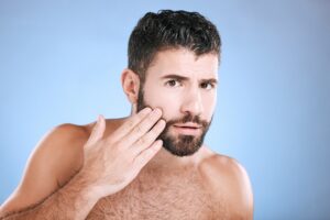 Skincare,,Beard,Grooming,And,Portrait,Of,Man,On,Blue,Background
