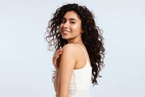 Woman with healthy hair after hair restoration in Washington, DC
